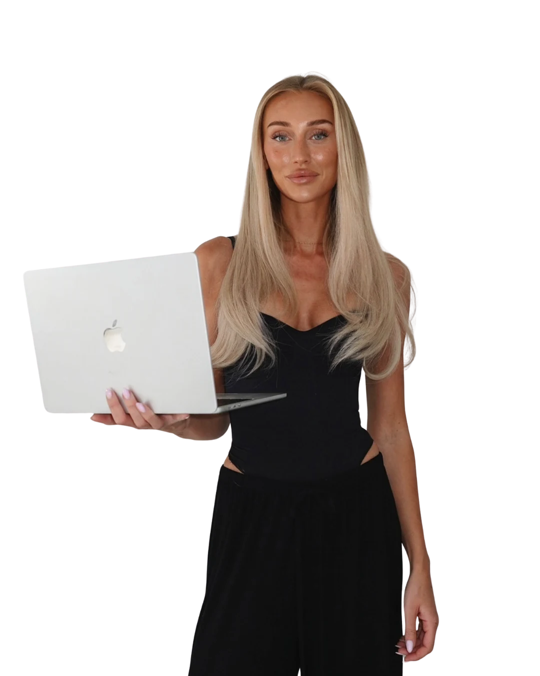 Sofie, founder and educator at NOLA Academy, holding a laptop